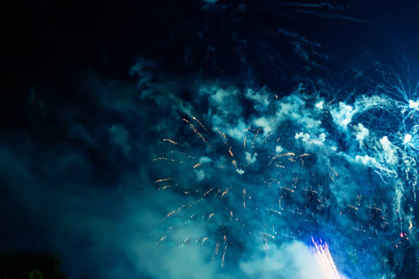 Bright, beautiful blue fireworks in the night sky. High quality photo