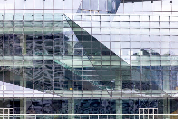 istock Closeup modern corporate glass building, background with copy space 1418287524