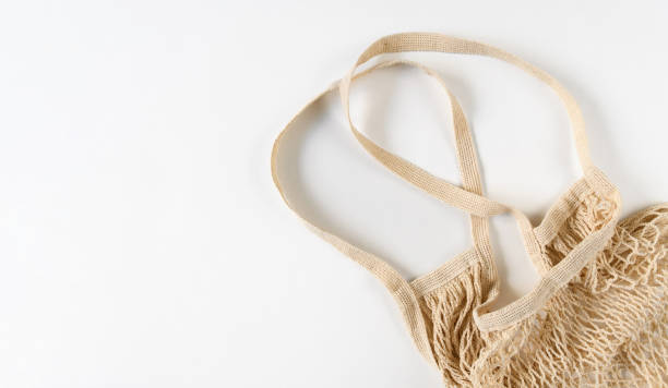 istock Eco friendly string bag on a white background. Concept of zero waste and environmental protection. copyspace. 1418287529