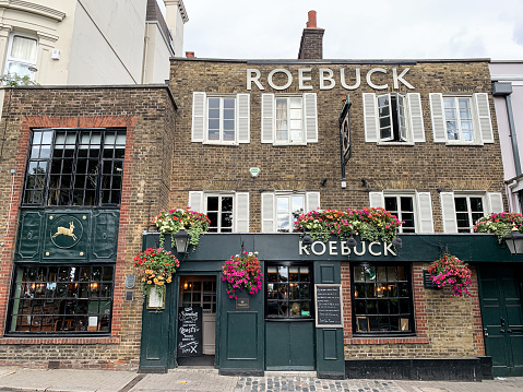 Facade of old traditional english pub Roebuck in Richmond, London. Richmond upon Thames. Richmond Hill, England, UK