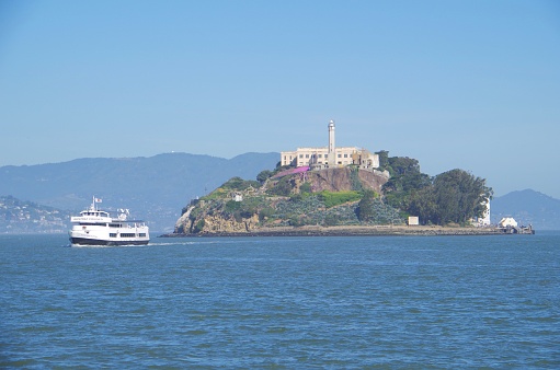 San Francisco, CA,USA - Apri,2, 2013 :Alcatraz Island is a small island, San Francisco Bay of California, floats at the 2.4km from the city of San Francisco.Cruise ship has come out from the ferry landing of the peer 33. Alcatraz is the famous prison island that famous Al Capone was also housed. 
Many tourists visit.It is used as a federal prison until 1963 . it is called The Rock．