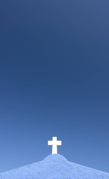 istock white cross on a blue wall with blue sky in the background 1418311539
