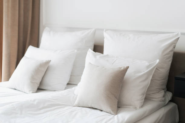 istock Fresh white linens in comfortable hotel room 1418325088