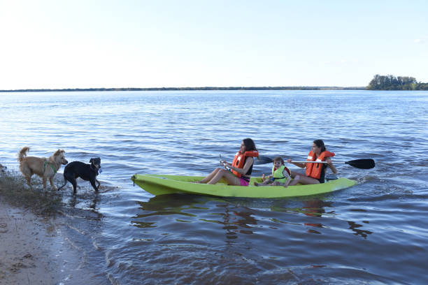 istock children playing on the river coast with a boat 1418333523