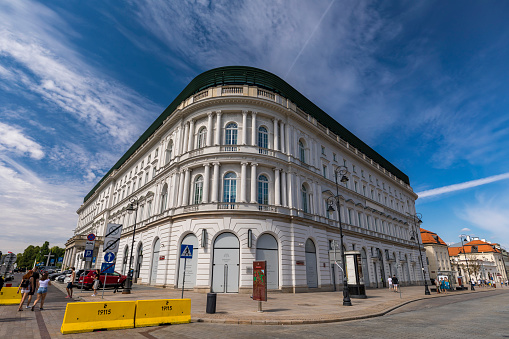 Warsaw, Poland - Aug 18, 2019: Exterior view of an historic building with multiple shops in Warsaw, Poland