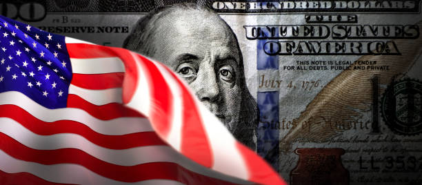 Making money and free enterprise concept, American flag and American one hundred dollar bill Making money and free enterprise concept, American flag and American one hundred dollar bill capitalism stock pictures, royalty-free photos & images