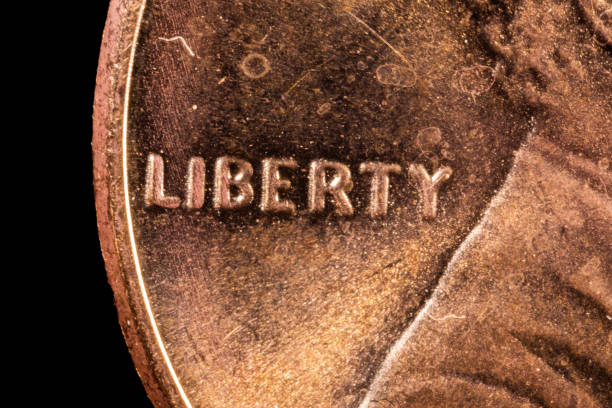 5X magnification, the word Liberty on a  Lincoln US  penny.