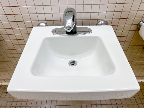 public restroom with sink and faucet