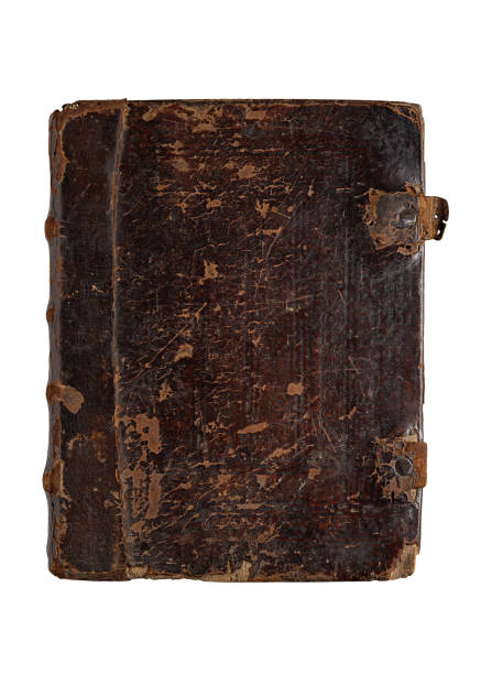 istock Old worn book in brown leather cover. 1418349567