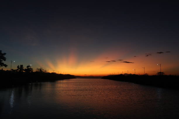 istock colorful dramatic sky with clouds at sunset. Sunset in  the lake 1418354757