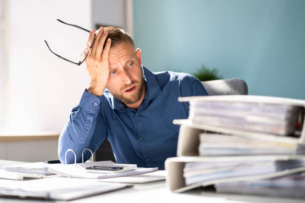 istock Bored Workaholic Accountant Businessman 1418355625