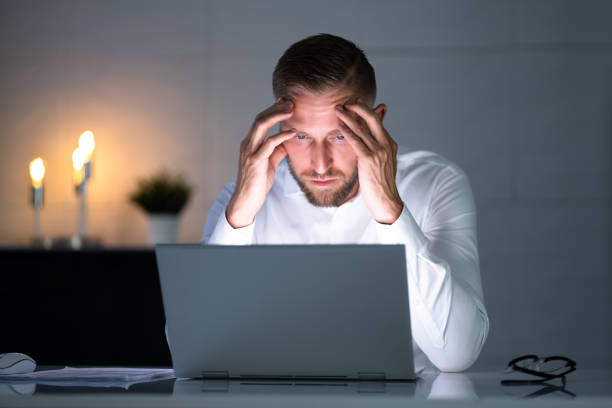 istock Stressed Depressed Man At Desk 1418358471