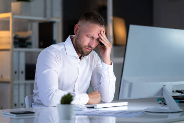 istock Stressful Business Man Working On Laptop 1418358483