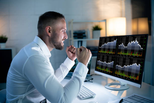 istock Successful Stock Market Trader Looking At Graphs 1418358530