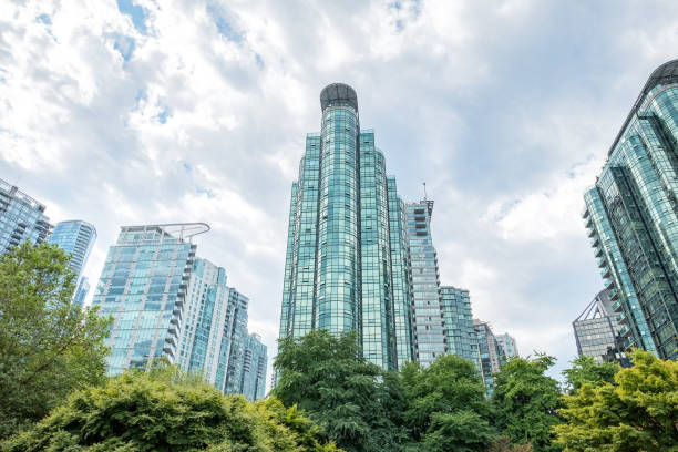 istock Tree-Lined Public Park Bordered by Modern Apartment and Office Towers 1418364952