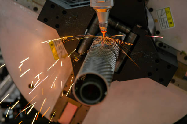 istock Laser cutting machine working with metal workpiece with sparks 1418365461