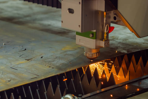 istock Laser cutting machine working with sheet metal with sparks 1418365482