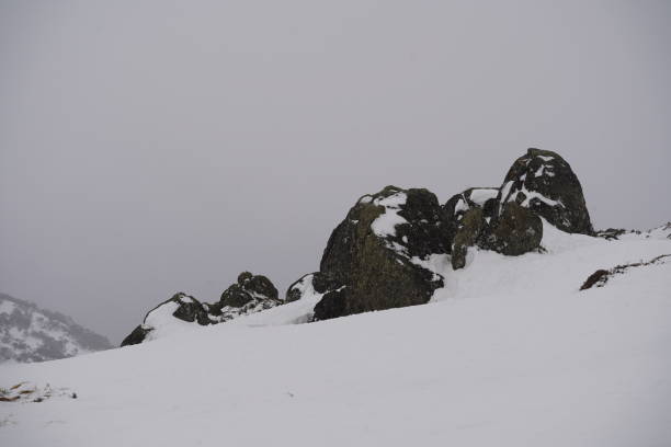 istock Boulders covered by snow 1418367818