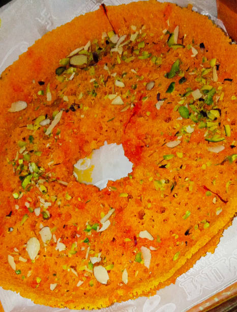 istock Ghevar: Sweet, orange, pistachio, almonds 1418372235
