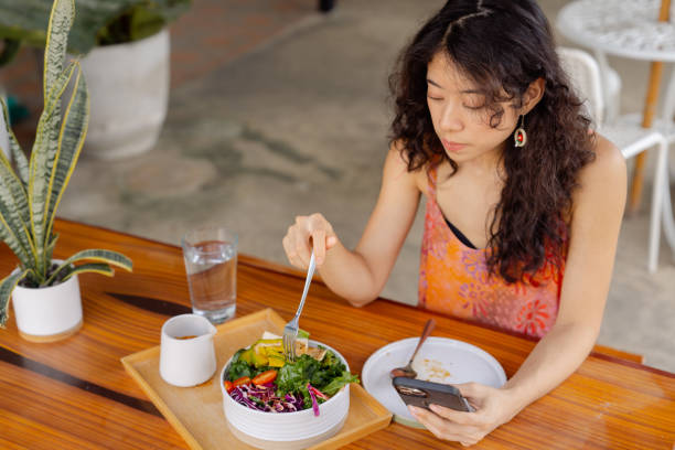 istock Healthy woman having vegan lunch while working at home. 1418378781