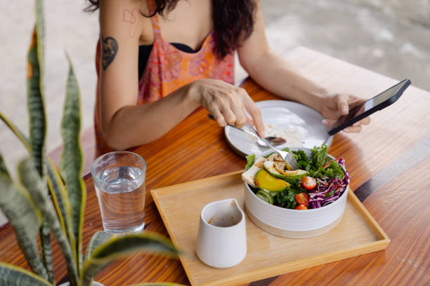 istock Healthy woman having vegan lunch while working at home. 1418378783