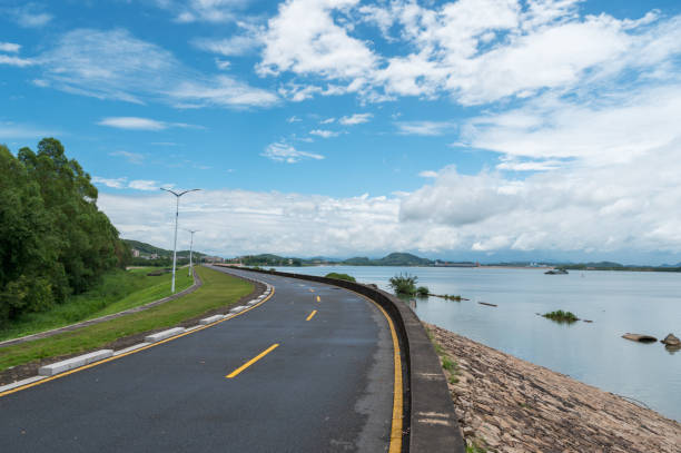 istock Dike and road beside the river 1418380427