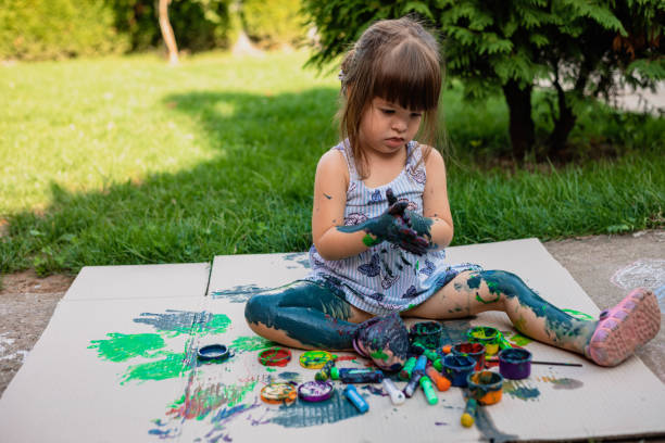 istock The child is making a mess using the watercolors. 1418382373