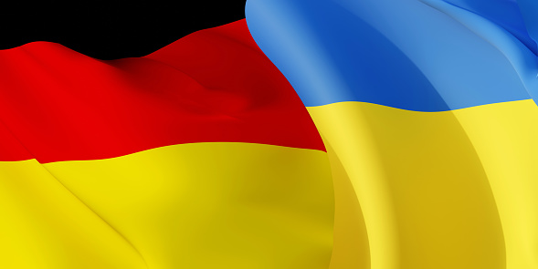 Deutsch and Ukrainian flags flying in the wind. Germany stand with Ukraine. 3D rendered image.