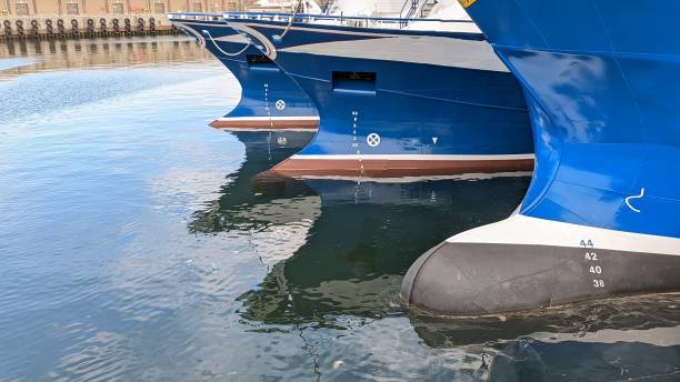 A toy boat on a blue background. Travel and tourism.