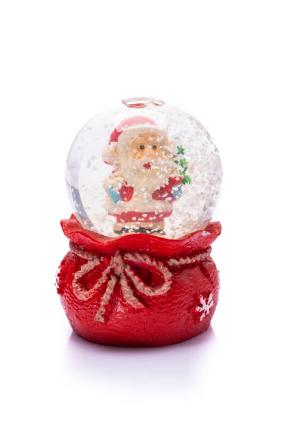 istock Santa claus snow globe on white background 1418390130