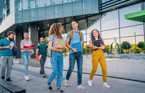 istock Friends walking on university campus 1418390662
