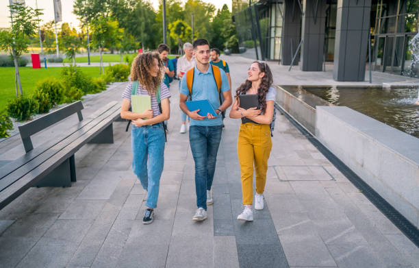 istock Friends walking on university campus 1418391615