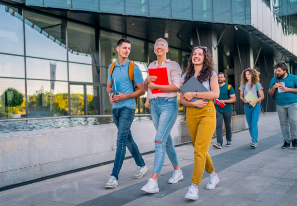 istock Friends walking on university campus 1418392042