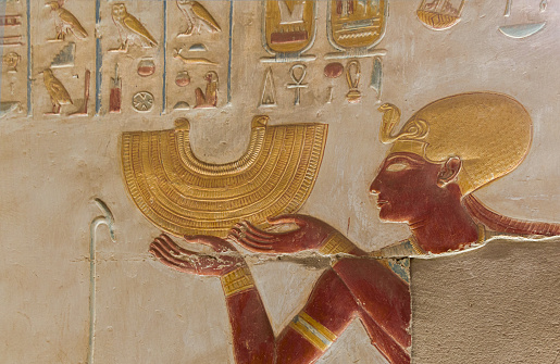 Pharaoh Seti I  offering gold to the goddesses at Abydos Temple . Egypt