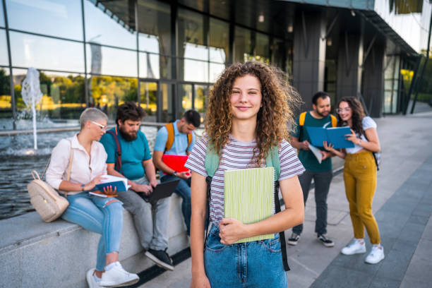 istock Female student outdoors with her friends 1418393479