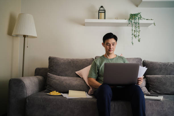 istock Mature Adult student programmer using laptop having online school class at home. 1418395462
