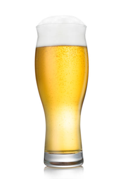 istock Lager beer in long glass with bubbles and foam on white background. 1418396021
