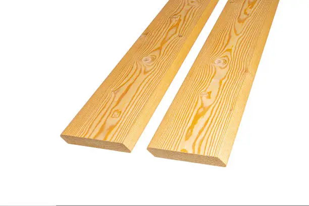 planken beveled from larch on a white background. photo
