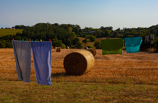 Hanging colorful clothes in the countryside along the Le Puy Route in the summer season