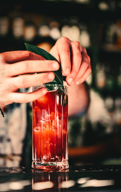 istock bartender making cocktail Bloody Mary in a nightclub bar 1418409752