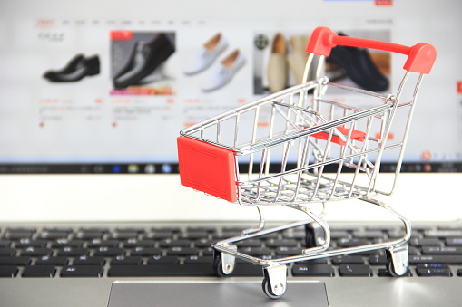 Online shopping, shopping cart and laptop computer