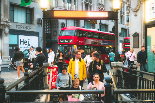 London, UK - 25 August, 2022: a crowd of people and commuters walking down the steps into Oxford Street tube station in central London, UK, at rush hour.