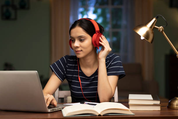 Young woman listening music at home, stock photo stock photo