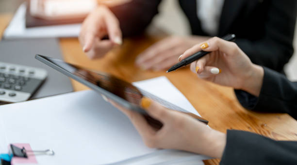 istock Team of business people working together in the office, discussing and analyzing graph chart of business strategy. 1418415673