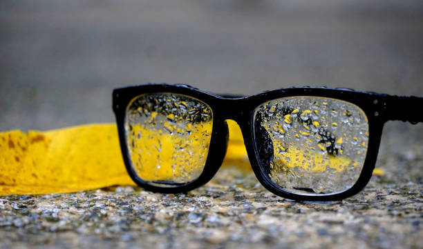istock raindrops on reading glasses placed on a concrete background. 1418420127