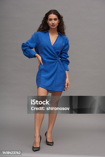 istock Young gorgeous female fashion model in royal blue short casual dress 1418423762