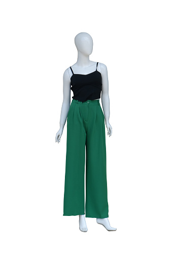 female mannequin in black blouse and green pants isolated on white background