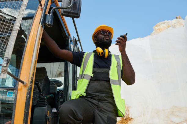 istock Young serious African American worker or foreman with walkie-talkie 1418436686