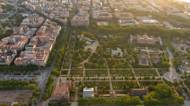 Aerial view of Barcelona City Skyline with Park de la Ciutadella - thirty hectare large park close to always crowded historic center of Barcelona The Parc de la Ciutadella is very idyllic and probably the greenest oasis in the megacity of Barcelona. It invites you to relax, to rebound and to go for long walks, as well as for a picnic. parc de la ciutadella stock pictures, royalty-free photos & images