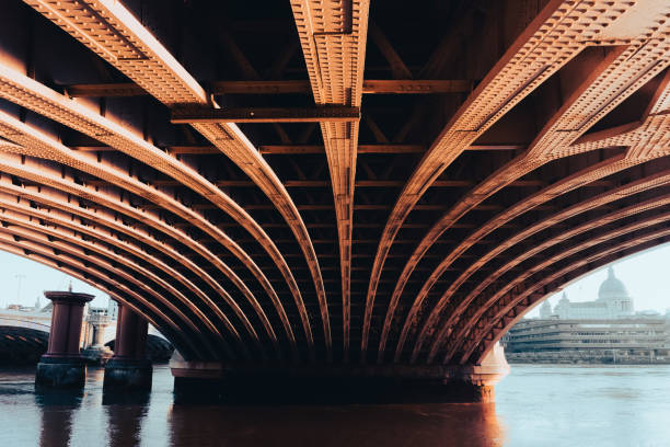 Under bridge River Thames in London with St Paul's Cathedral in background